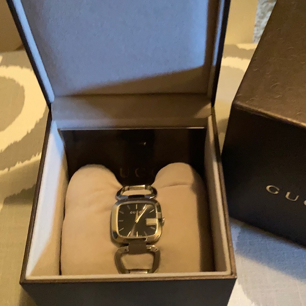 Gucci watch silver and black.